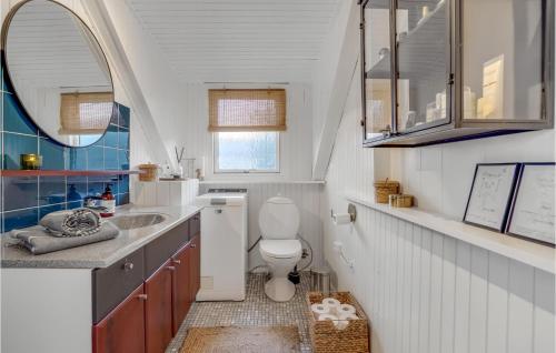 a bathroom with a toilet and a sink at 2 Bedroom Gorgeous Home In Skjern in Skjern