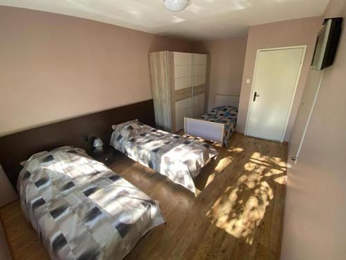 a room with two beds in a room at J&Z Rooms in Burgas City