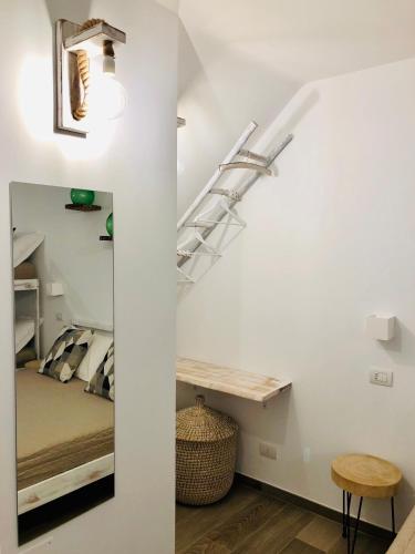 a room with a bunk bed and a ladder in a room at Atipico B&B in Bari
