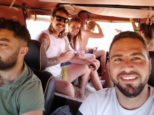 a group of people sitting in the back of a bus at OASİS AT AYFİLON in Rizokarpaso