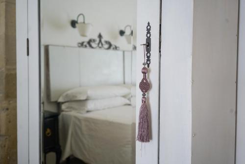 a glass door with a tassel hanging from it at Masseria Spartivento in Conca Specchiulla