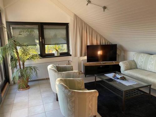 Ruang duduk di Das Loft Dachstudio mit Herkulesblick