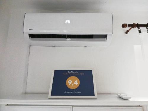 a laptop computer sitting on top of a stove at Apartman Kristina in Čapljina