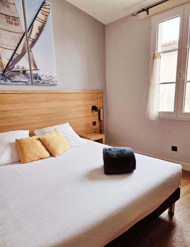 Letto o letti in una camera di Hôtel du Port