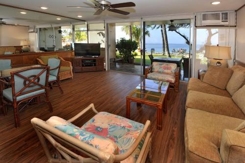 a living room with a couch and a table at The Hale Pau Hana in Kihei