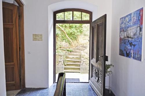 
a room with a door leading to a hallway at Art Hotel & Hostel in Passau
