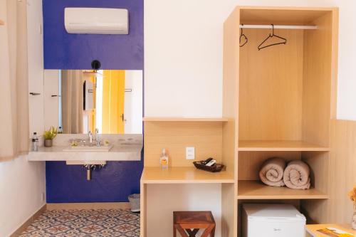 a bathroom with a sink and a mirror at Pousada Relicário in Tiradentes
