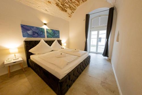 Letto o letti in una camera di Servus Apartments Old Town Premium
