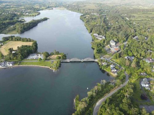an aerial view of a bridge over a lake at Skelligway Kenmare - Your Luxury Holiday Home in Kenmare