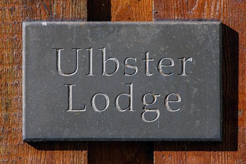 a sign for aldreth lodge on a wooden wall at Ulbster Arms Hotel near Thurso in Halkirk