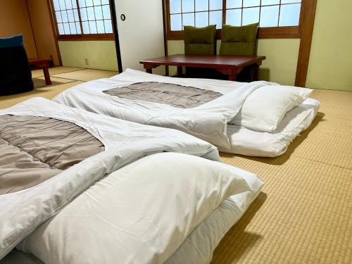 A bed or beds in a room at Shima Akari - Vacation STAY 66905v