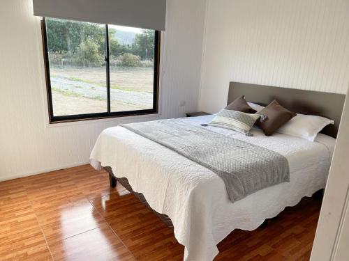 Cama o camas de una habitación en Cabañas Los Naranjos - Lanco