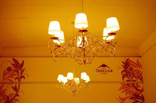 a chandelier hanging from a ceiling in a room at Hotel Tierrasur in Arequipa