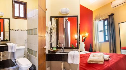 a bathroom with a sink and a toilet and a mirror at Milkyway Hotel in Jericoacoara