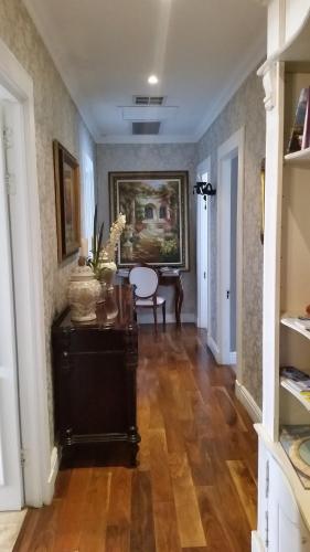 a hallway of a home with a wooden floor at Mt Bijoux Preferred Accommodation in Bloubergstrand