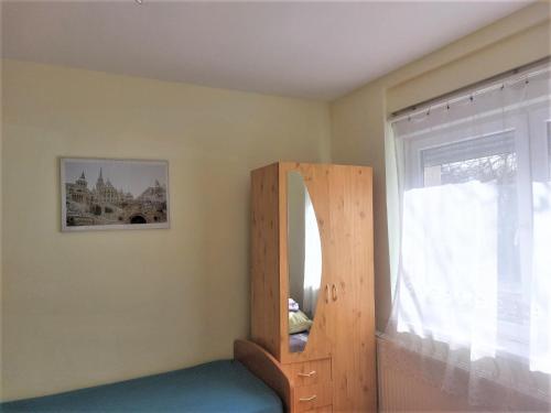 a room with a mirror and a window at Red Locomotive Apartment in Budapest