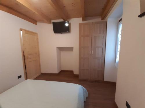 Ένα ή περισσότερα κρεβάτια σε δωμάτιο στο Casa Ylenia