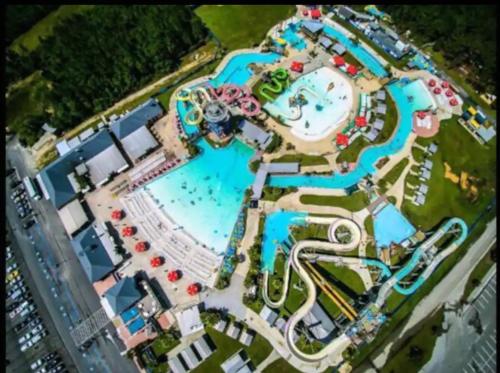 an aerial view of a pool at a resort at 4/2 Home Close to Beach, Centrally located! in Gulfport