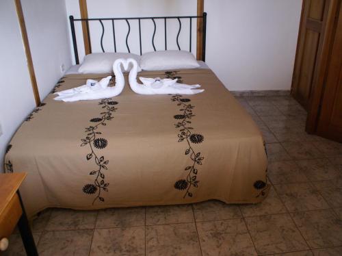 Cama o camas de una habitación en Hotel Posada Los Delfines