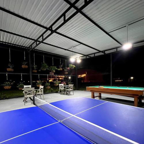 a ping pong court with a ping pong table at Hotel Capri Doradal in Doradal
