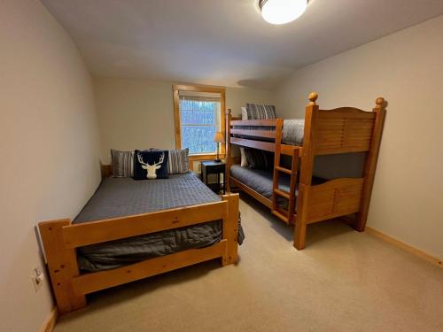 a bedroom with two bunk beds and a chair at NEW Single family home with spectacular views and lots of space Privacy convenience and style in Carroll