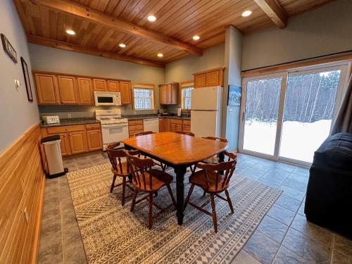 a kitchen with a table and chairs in a room at NEW Single family home with spectacular views and lots of space Privacy convenience and style in Carroll
