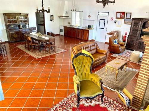 a living room with a couch and a table at HERDADE DO CORVAL in Reguengos de Monsaraz