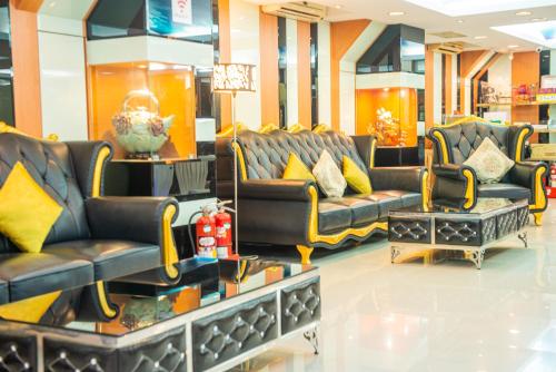 a store with couches and chairs in a mall at Wenpin Hotel - Pier 2 in Kaohsiung