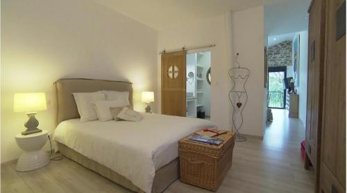 Ένα ή περισσότερα κρεβάτια σε δωμάτιο στο LA MAISON D INÈS and UGOLIN & SPA