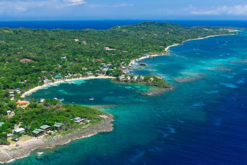 an aerial view of an island in the ocean at Purple Palace in Sandy Bay