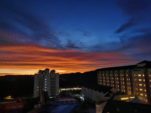 a view of a city at sunset with buildings at Walk-Up To SIAR - Children Not Allowed in Cameron Highlands