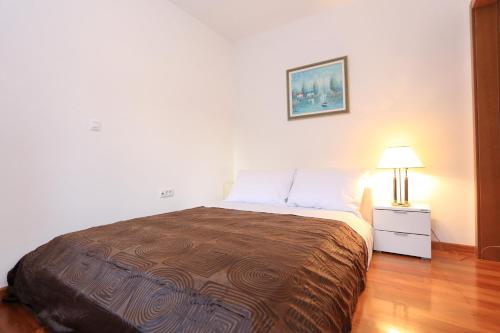Ένα ή περισσότερα κρεβάτια σε δωμάτιο στο Apartment Kolovare by Belmont Realty