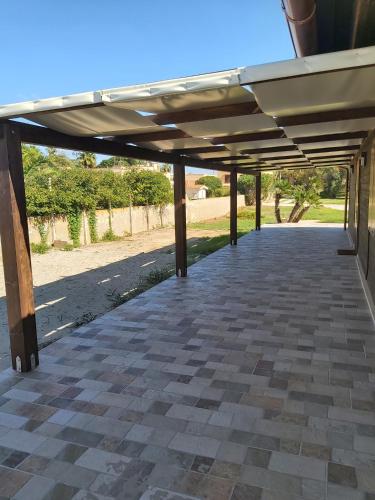 an empty patio with awning on a building at Ad un passo dal mare in Marsala