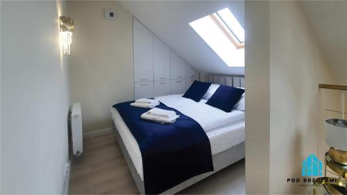 Postel nebo postele na pokoji v ubytování Pod Brzozami Apartamenty Gea Eco
