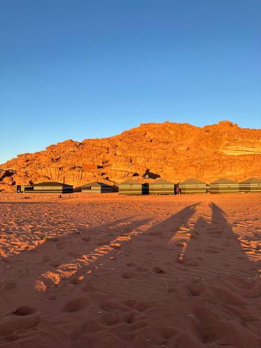 a shadow of a person in the desert at bedouin future camp in Wadi Rum