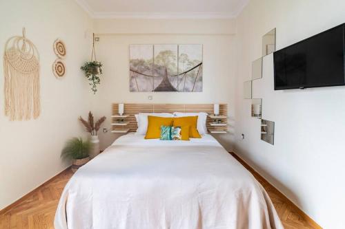 Postel nebo postele na pokoji v ubytování Cozy apartment in Athens