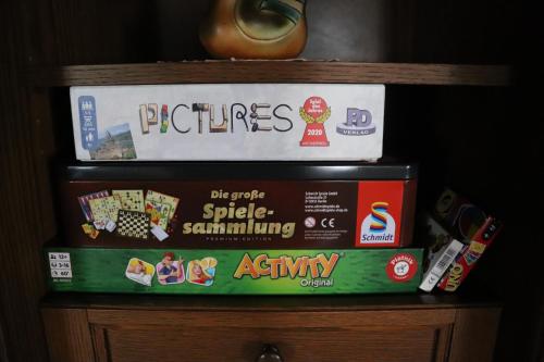 a stack of books sitting on top of a shelf at Ferienhaus Aurelia in Kitzeck im Sausal