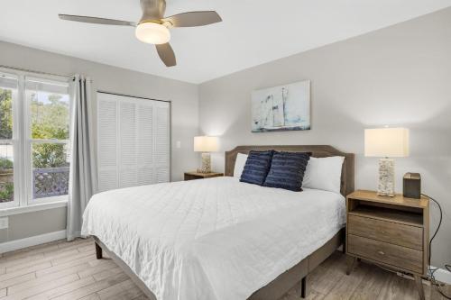 a bedroom with a bed and a ceiling fan at Hidden Dunes Beach Cottage 208- Dune Our Thing in Destin