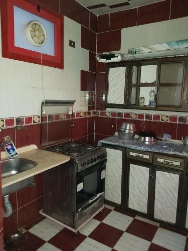 a kitchen with a stove and a sink at الفاوى - القصير in Quseir