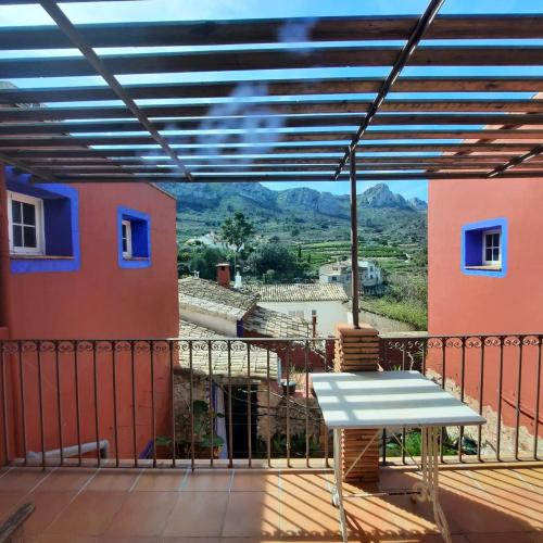 a view from the balcony of a house with a table at Casa Gallinera in Benissiva