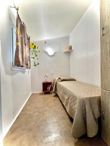 Letto o letti in una camera di Camping Village Tuscia Tirrenica