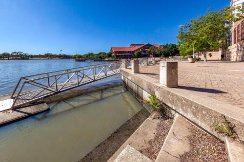 a river with a metal bridge over the water at Tuggeranong Short Stay #08 - Sleeps 6 in Tuggeranong