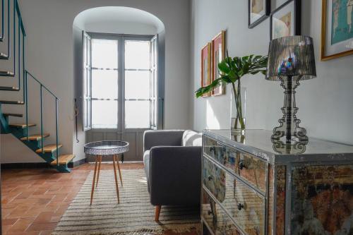 a living room with a couch and a table at Hospederia Santa Clara in Utrera