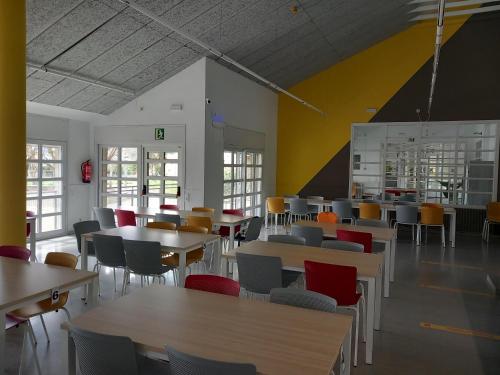 a dining room with tables and chairs at La Seu d'Urgell Xanascat in La Seu d'Urgell