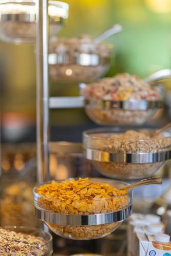 a bunch of pies in pans on a buffet at Boardinghouse HOME - adults only - in Konstanz