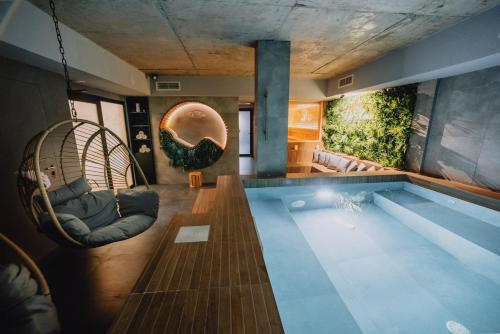 a house with a swimming pool with two chairs at Студио с вана и гледка в "The House" с Термална зона in Velingrad