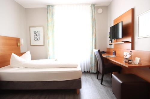 Postel nebo postele na pokoji v ubytování Hotel Alexa