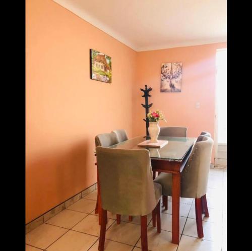 a dining room with a table and chairs at House explorer in Cusco