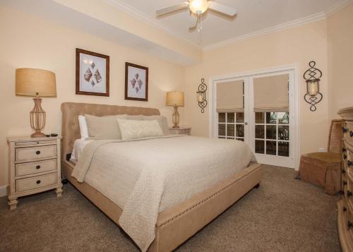 a bedroom with a large bed and a window at Oasis at Orange Beach 1103 in Orange Beach