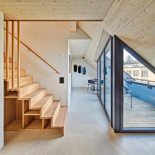 a view of the staircase from the hallway of a house at Liv Suites - Self Check-in in Luzern